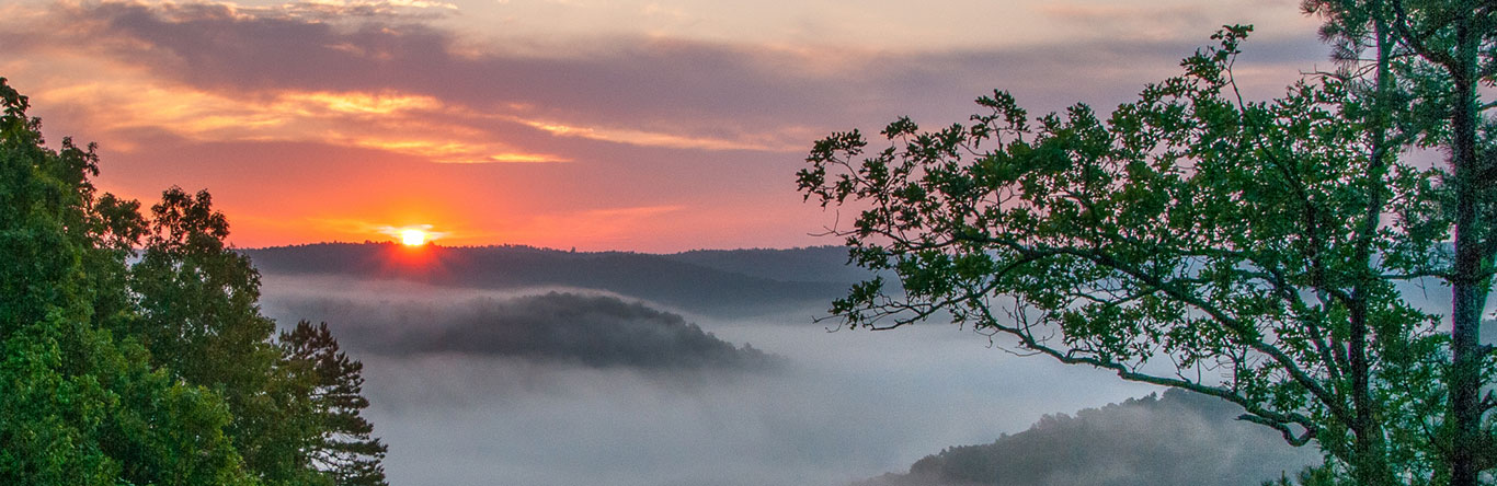 Sun rising over mountain
